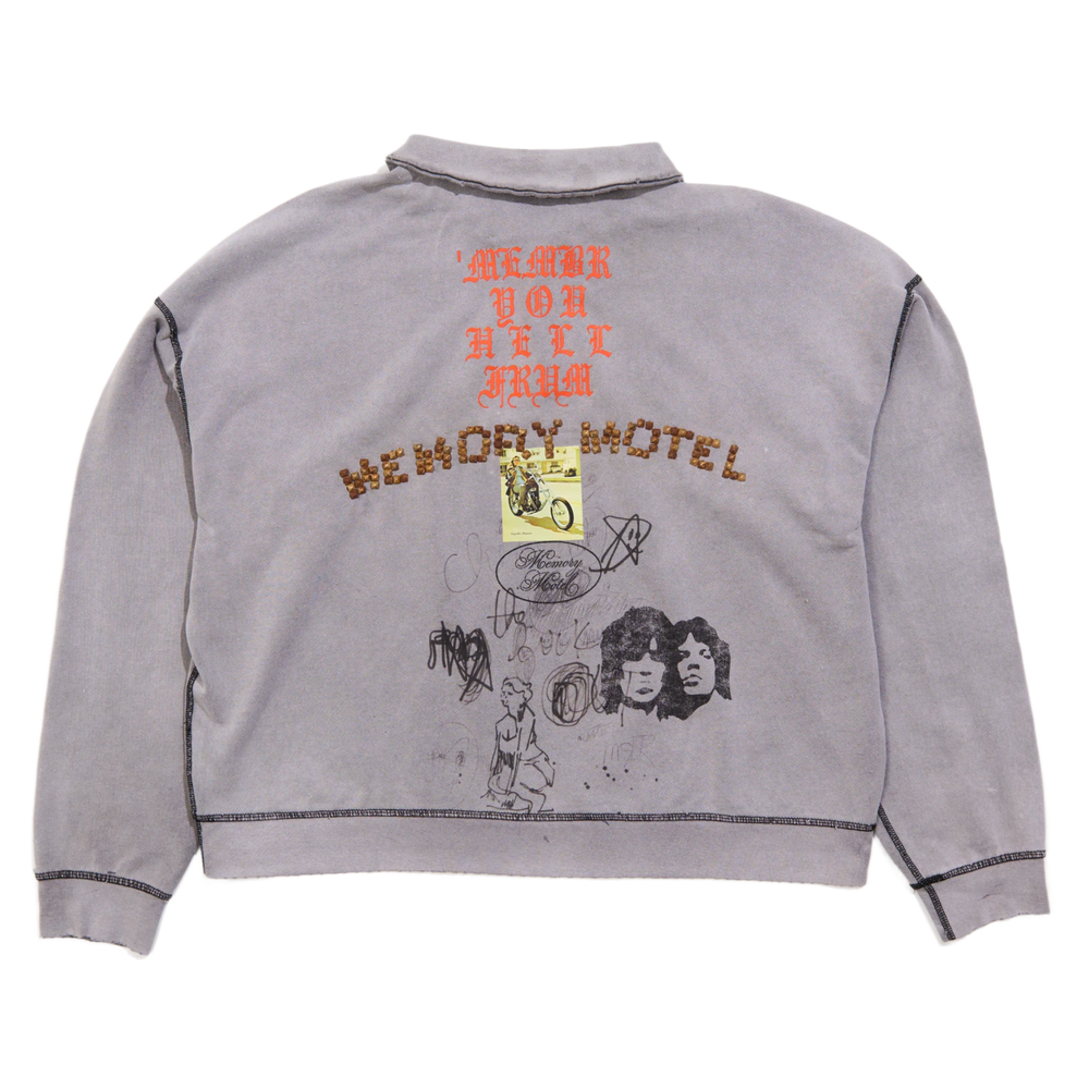 Back flat lay view of the faded grey Paly quarter-zip sweatshirt, showcasing a large orange and black graphic layout across the upper back with arched text reading 'SORRY BOUT THAT' above an detailed illustrative character print.