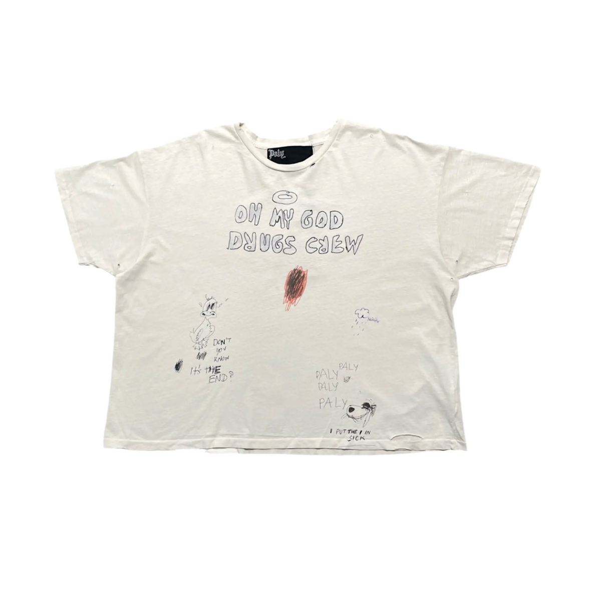 Front flat lay view of the Paly 'Drugs Crew' short-sleeve t-shirt in heavily distressed cream cotton, featuring a large circular reddish-brown bleach stain on the center chest underneath faded black text that reads 'JOIN MY CLUB DRUGS CREW', accented by small black hand-drawn star and face illustrations near the hem.